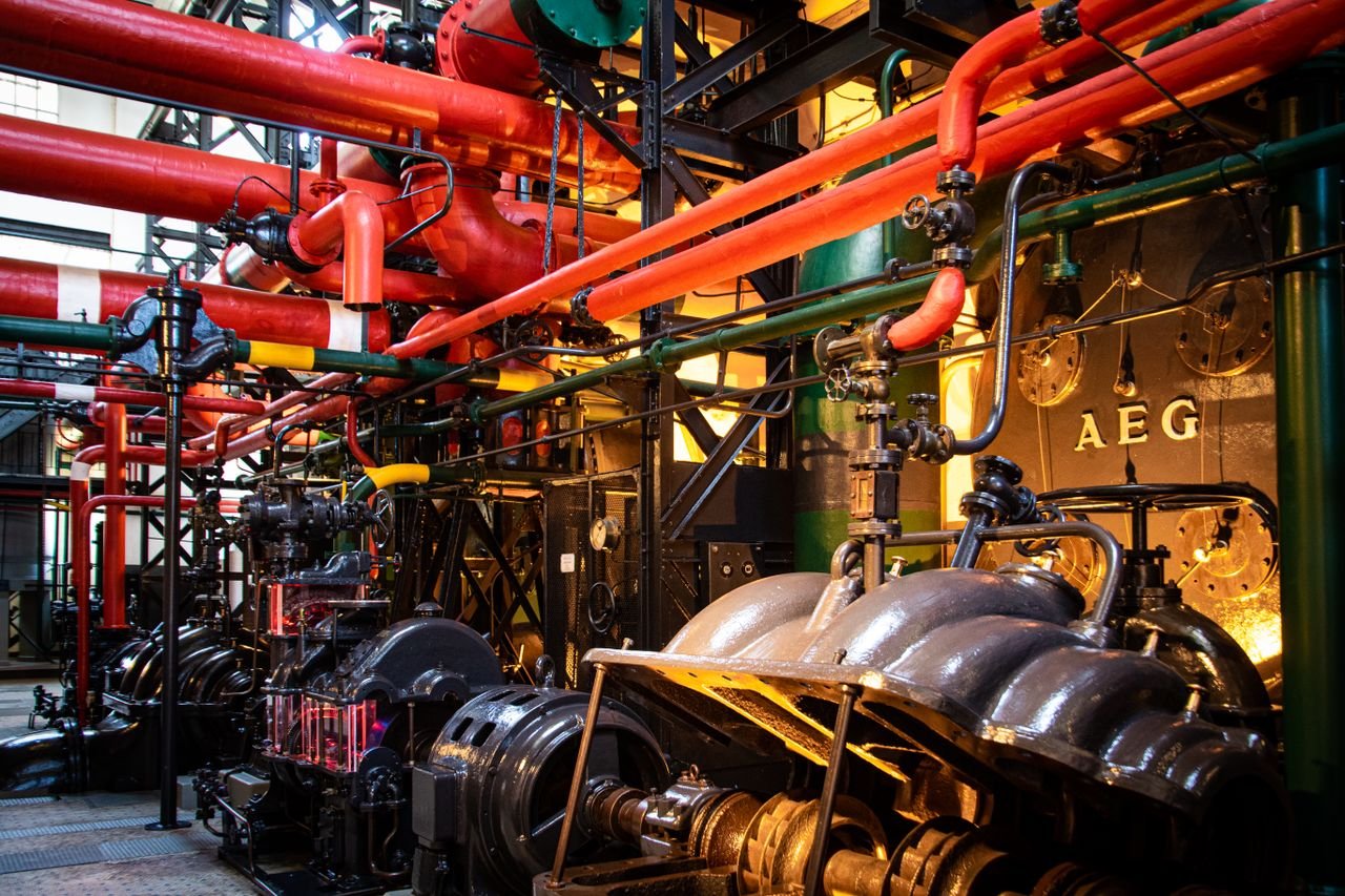Crafting Captivating Headlines: Your awesome post title goes here Vibrant industrial machinery with red pipes and complex equipment in a factory.