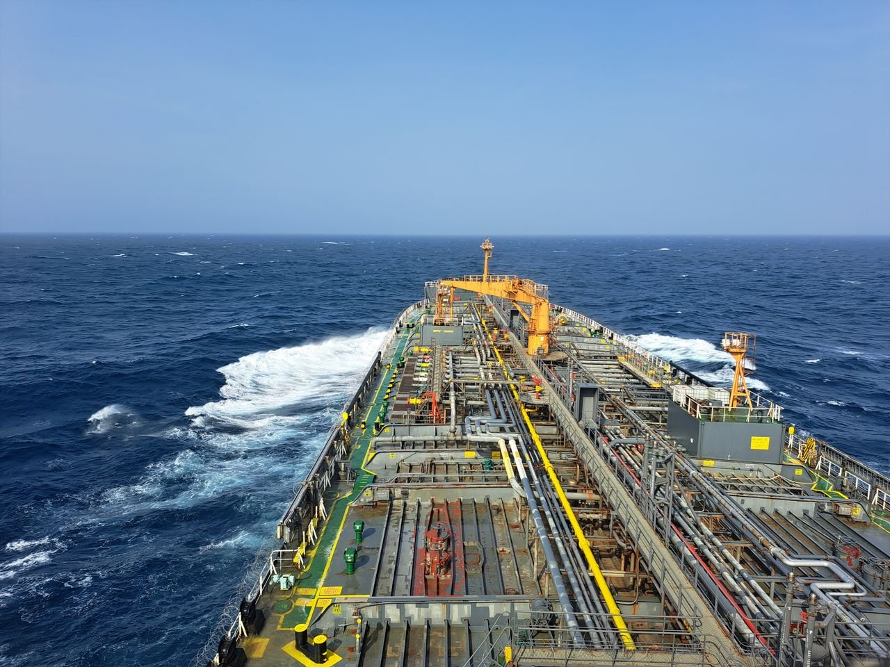 Mastering the First Impression: Your intriguing post title goes here Aerial view of a large industrial ship navigating the open ocean, showcasing heavy industry transportation.